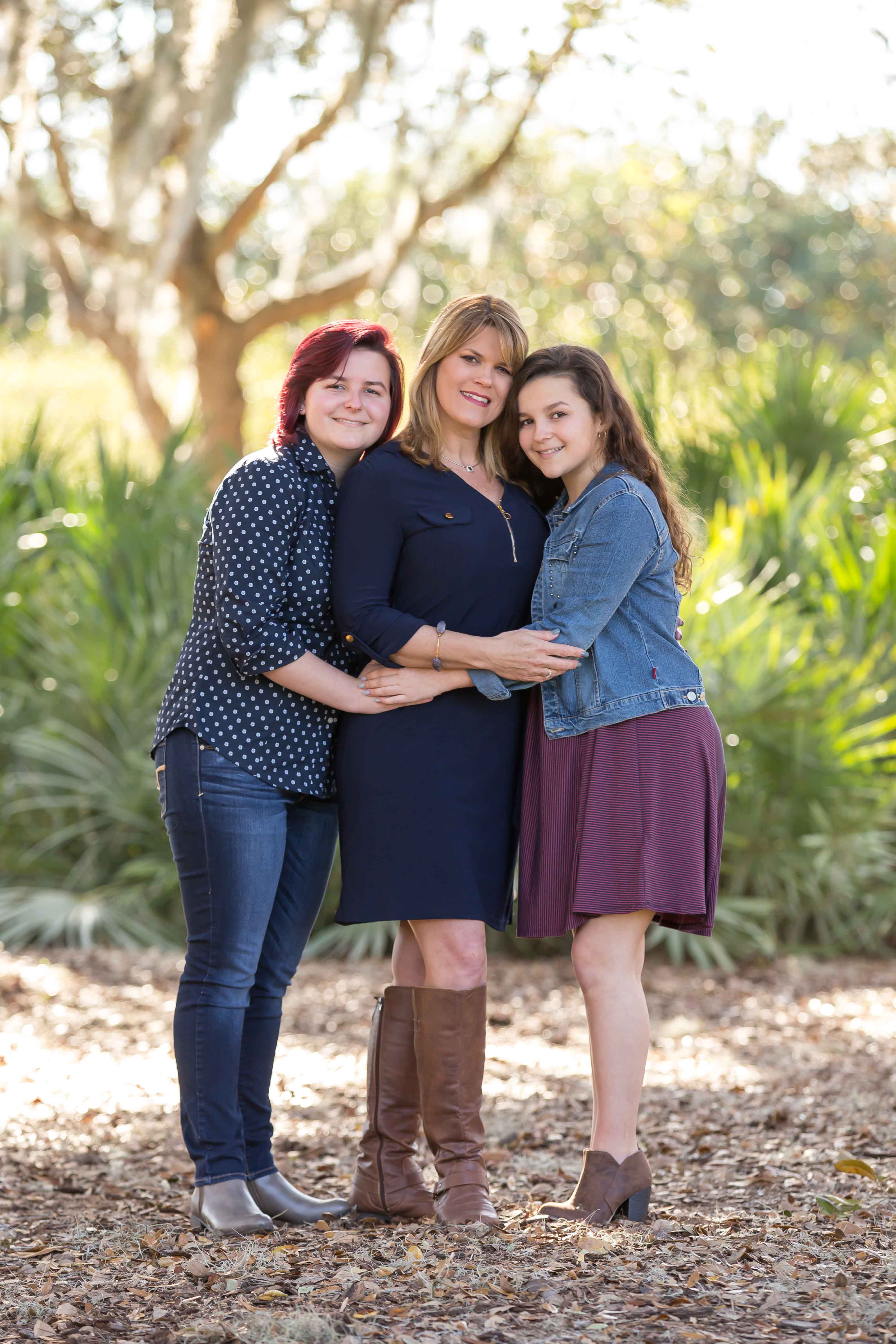 mom and daughters embrace