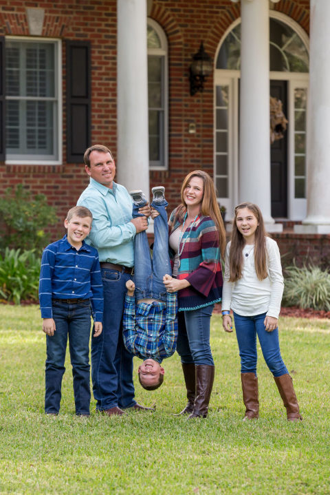 family session hanging son by feet