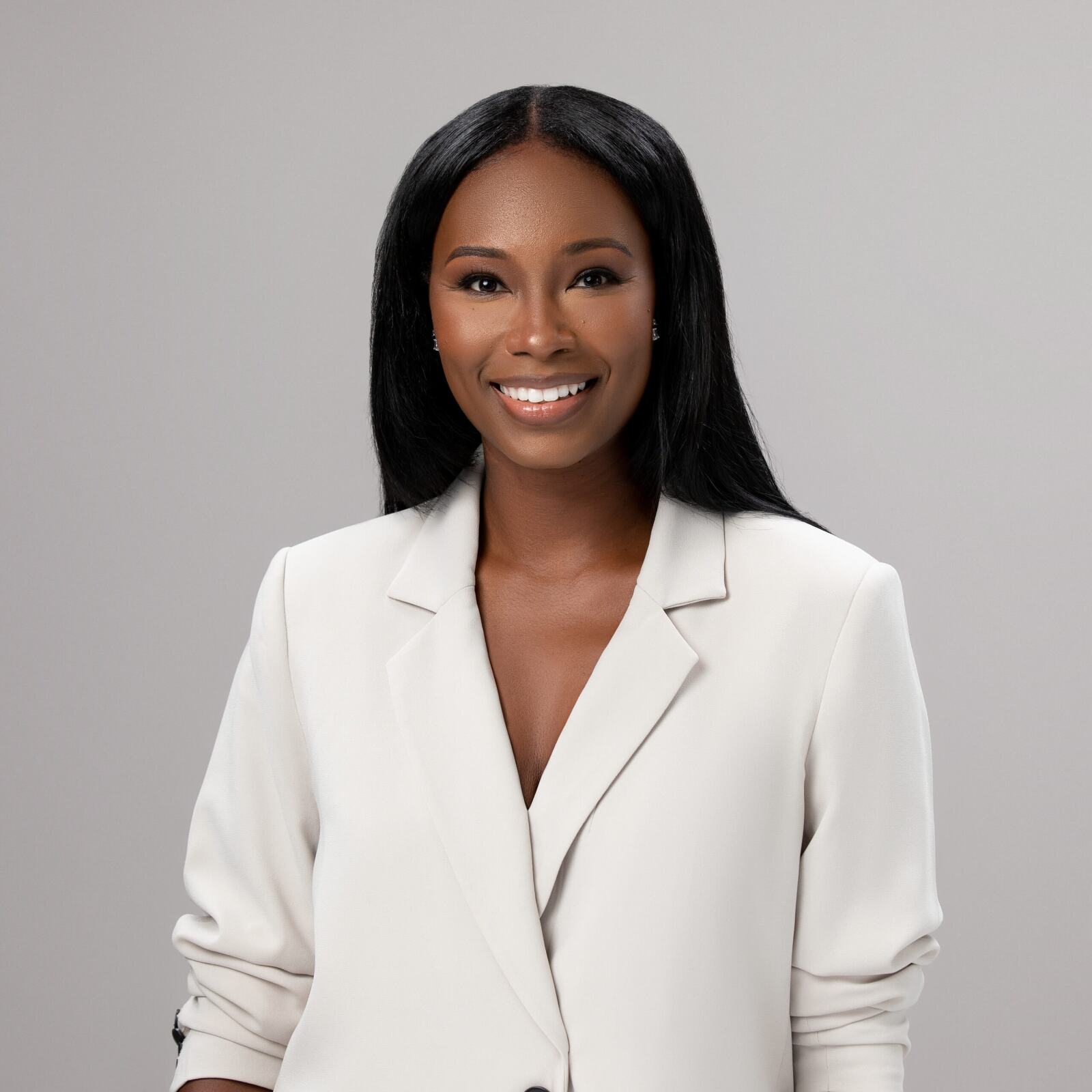 Engaging African American business woman wearing a white suit
