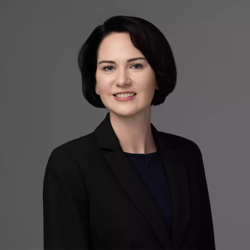 Studio headshot of a professional woman in a black blazer with a confident smile, photographed by Jenny E Photography in Ocala, Florida